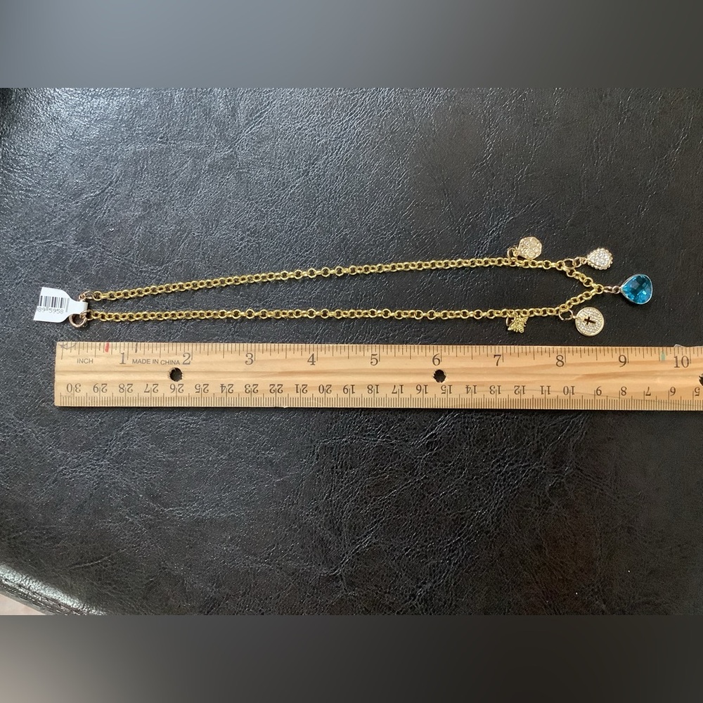 Gold Charm Necklace with Blue Crystal Pendant, Cross, and Bumblebee Charms. NWT - Picture 3 of 4